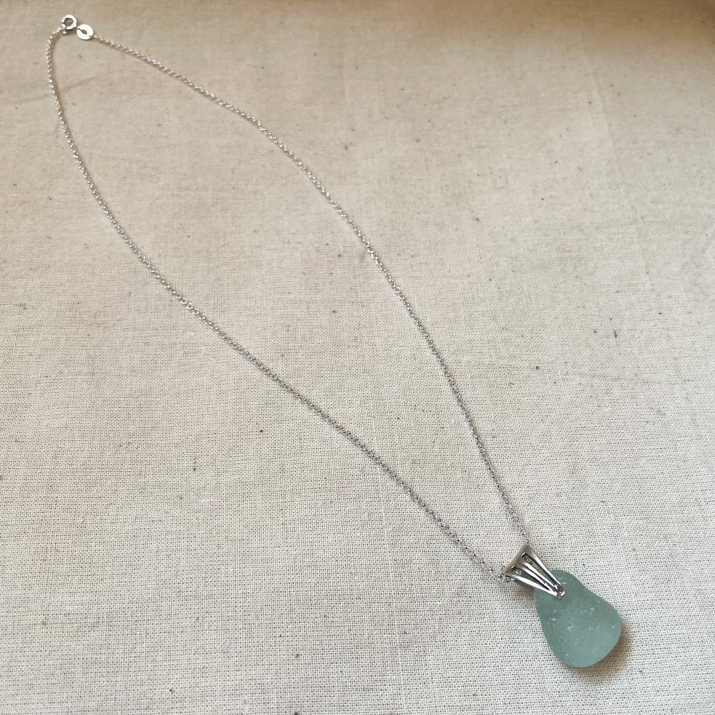 blue sea glass pendant on silver belcher chain