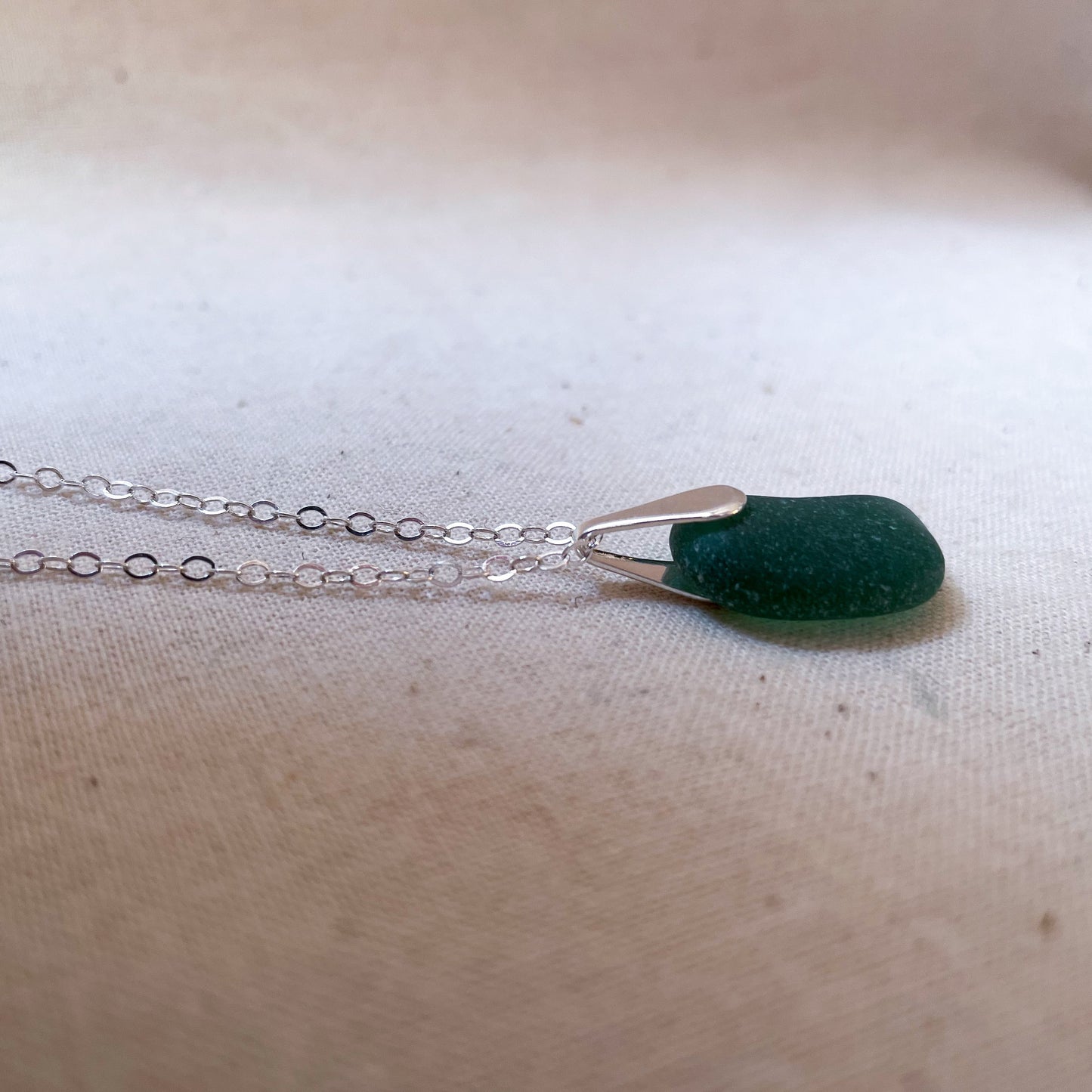 Green sea glass pendant on silver chain