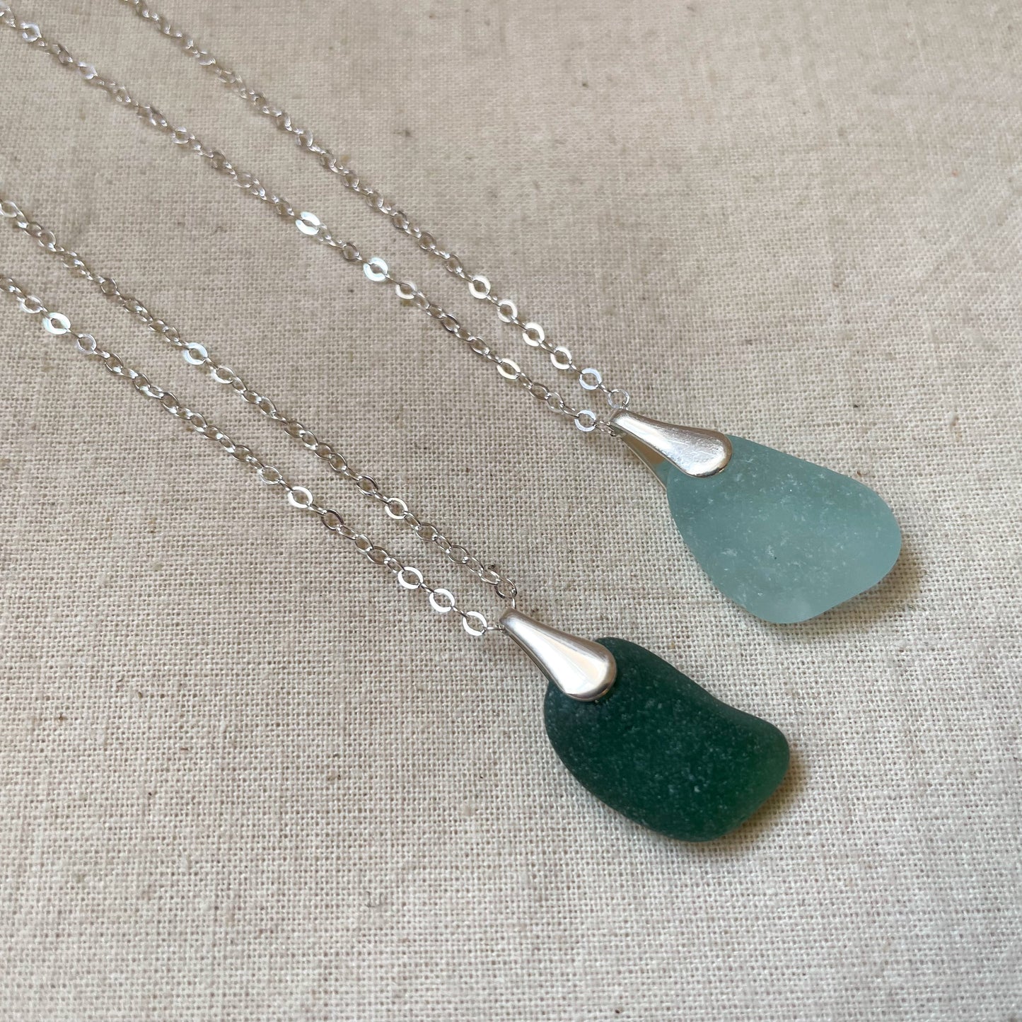 green and blue sea glass necklaces on silver chains