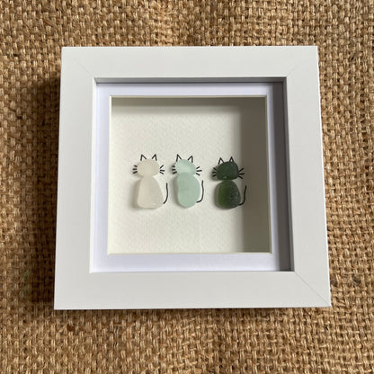 Sea glass cats in frame, 3x cats, white seaglass, blue seaglass and green seaglass cats 