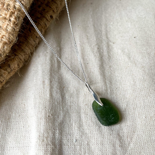 green sea glass pendant on a fine silver chain