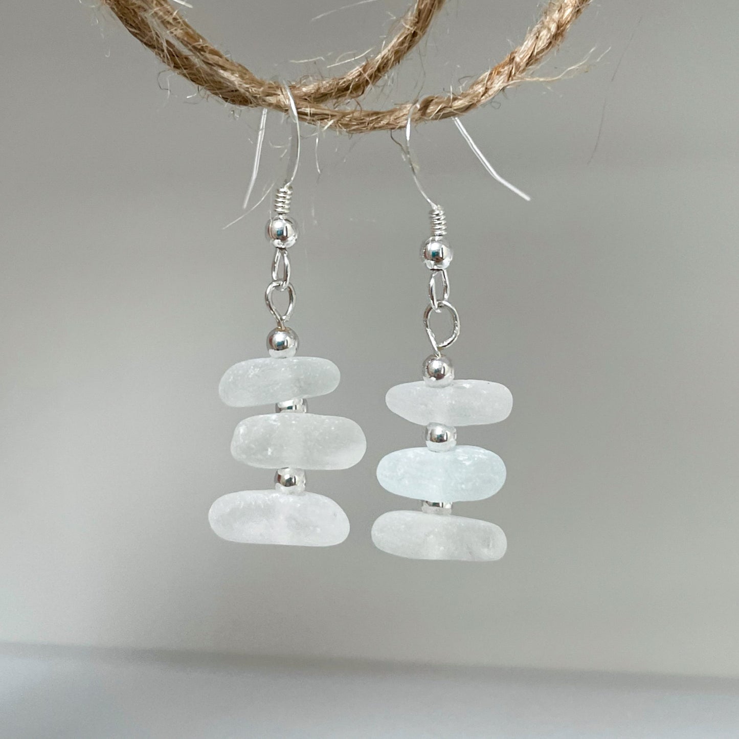 white sea glass dangle silver bead earrings