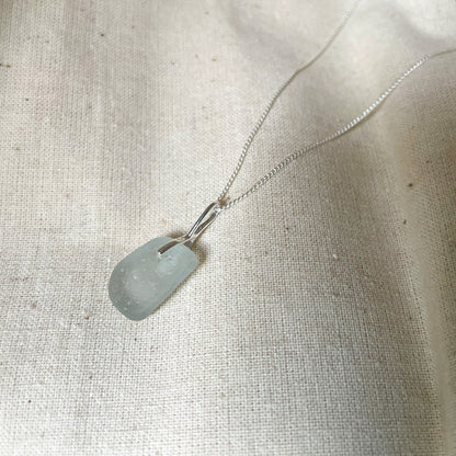 Back of white sea glass pendant